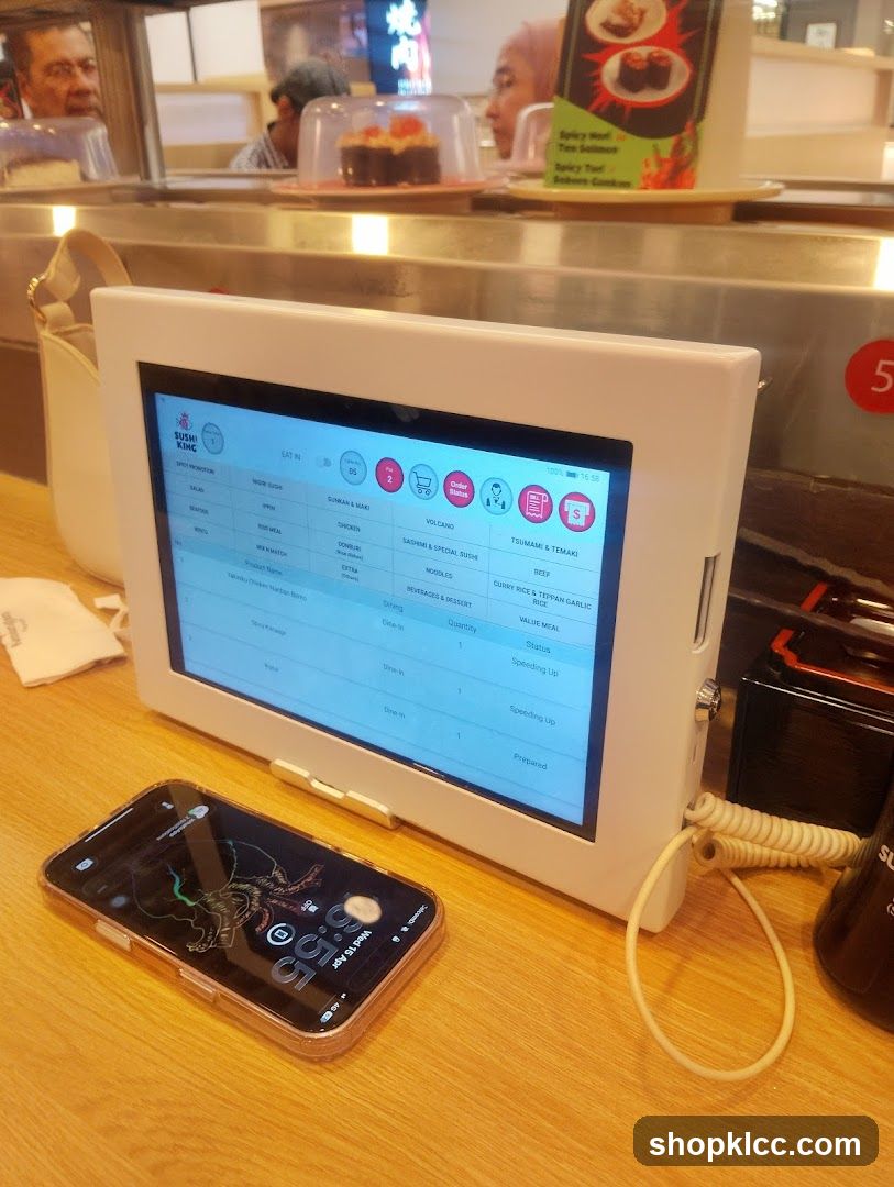 KFC Order Screen and Phone on Counter