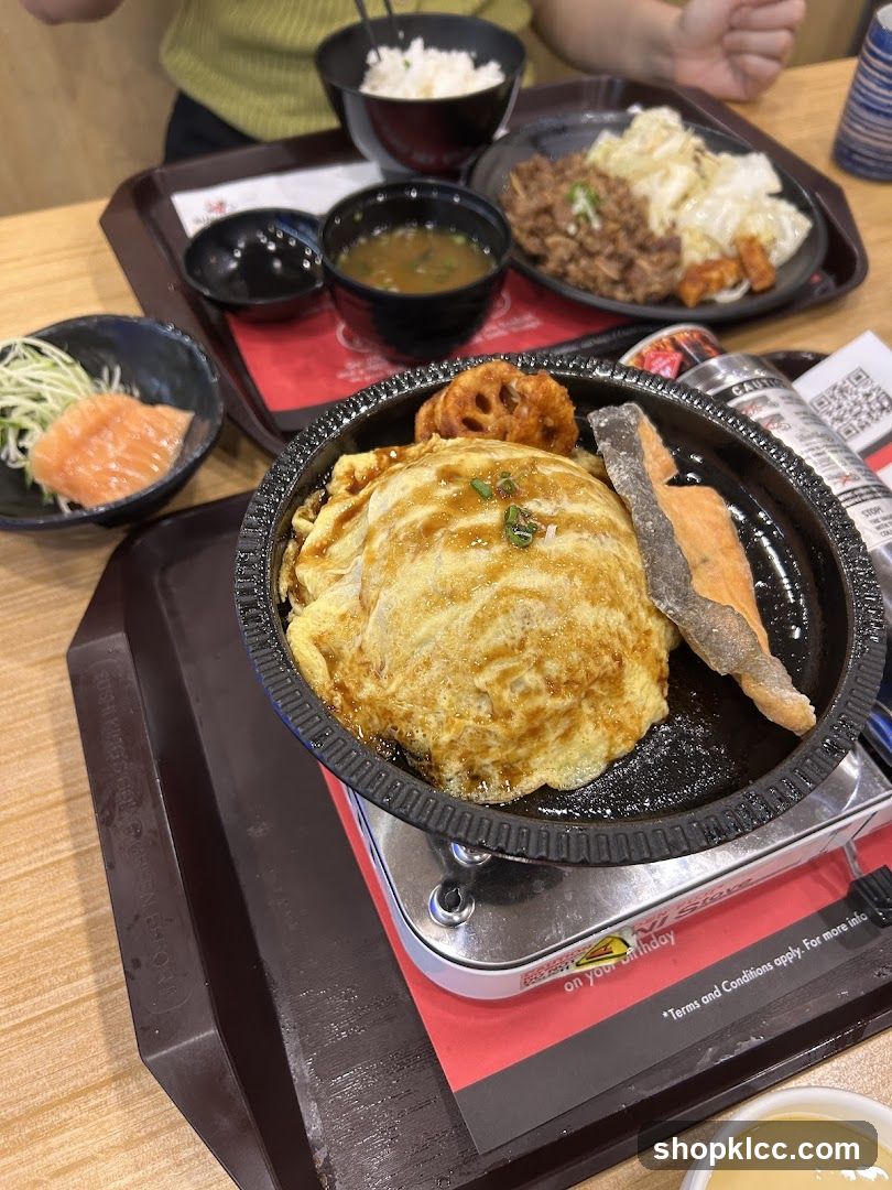 Japanese-style meal with omurice and side dishes