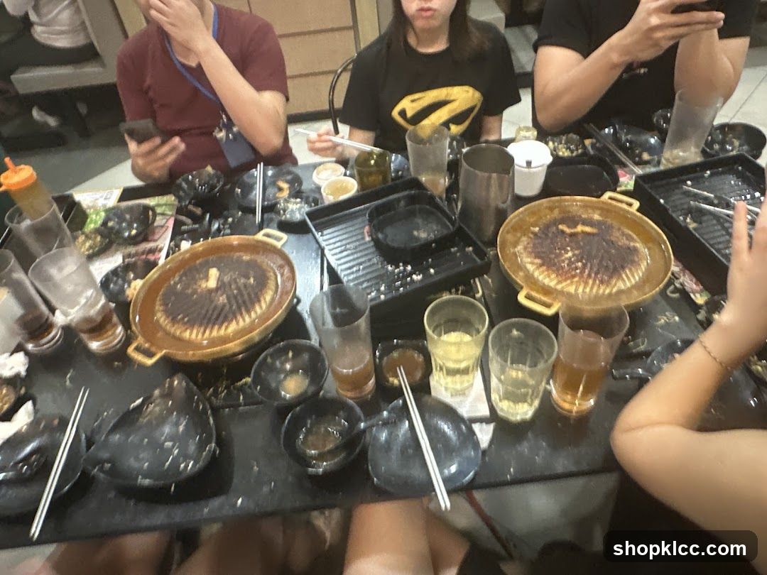 Group eating at Korean BBQ restaurant