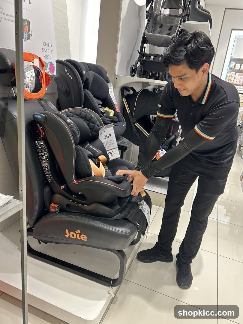 Salesperson demonstrating a car seat