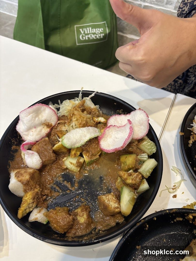 Food on a plate with a grocery bag in the background