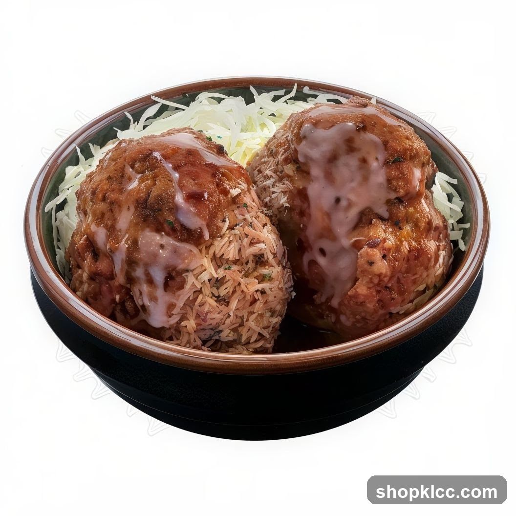 Two Meatballs with Rice and Shredded Cabbage
