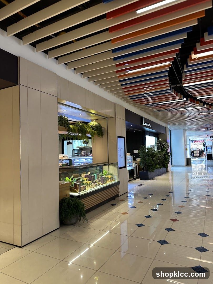 Indoor mall walkway with storefronts