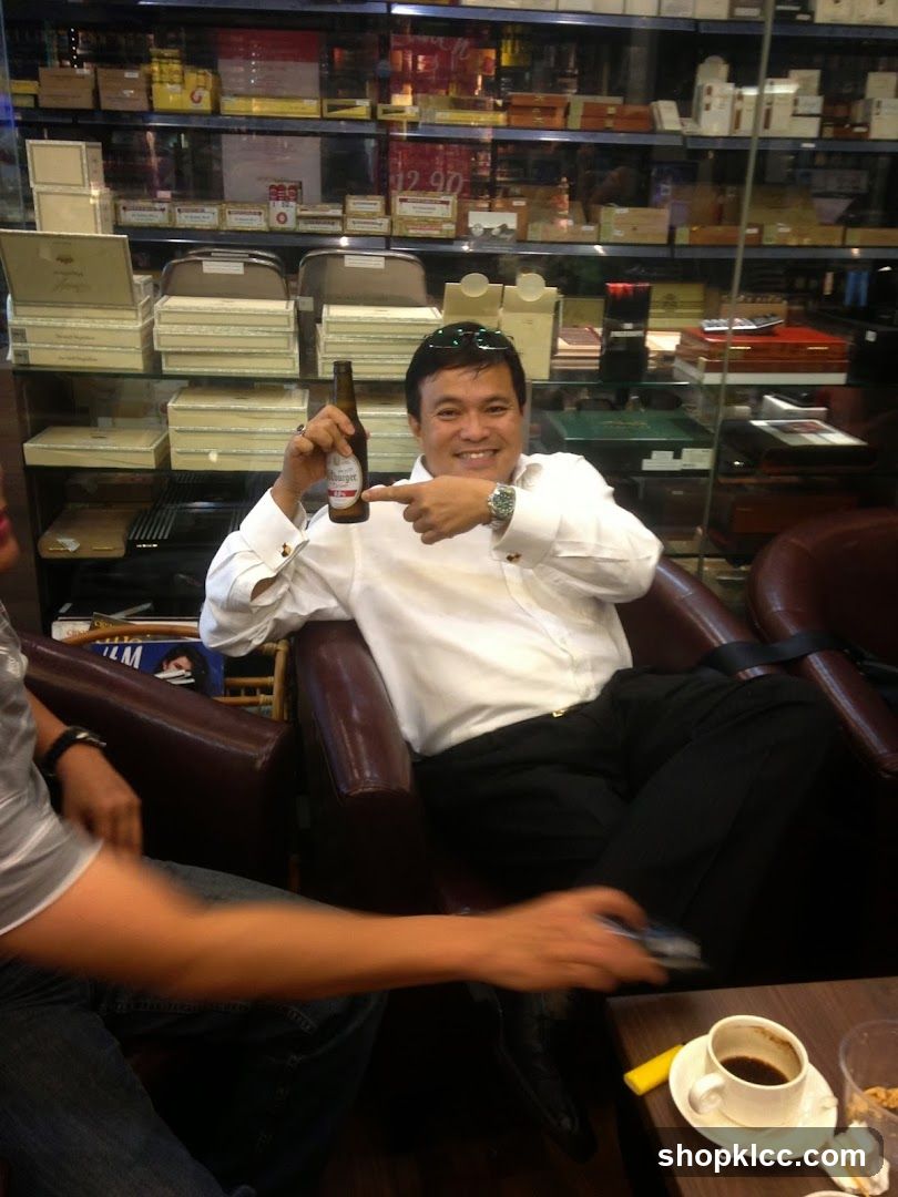 Man holding beer bottle in shop interior