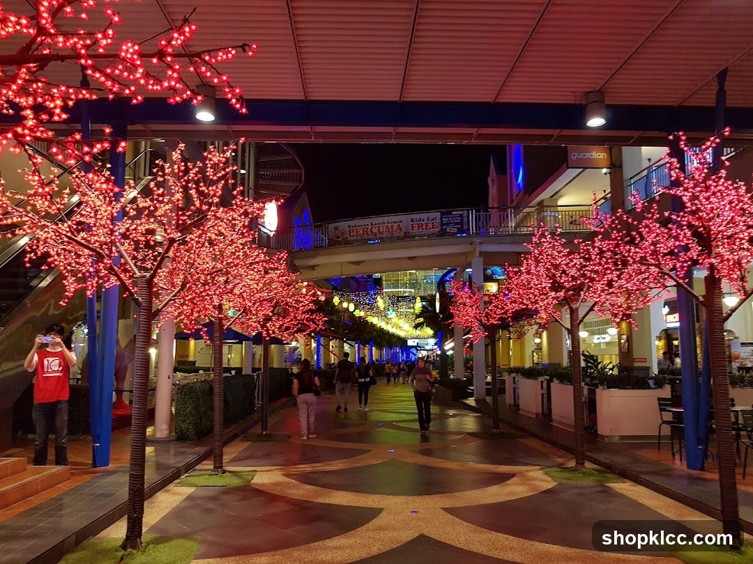 Nighttime Shopping Promenade with Decorative Trees