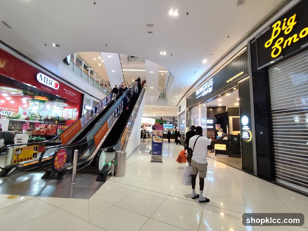Mall Interior with Escalators and Shops