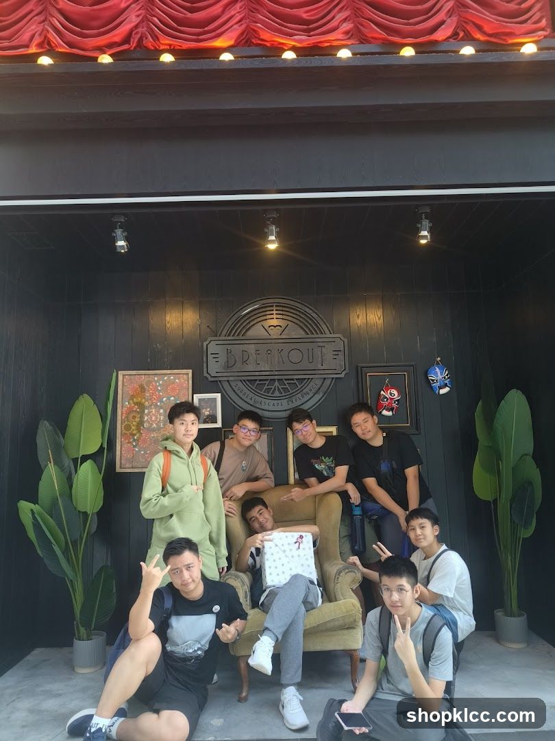 Group Posing in Front of Breakout Signage