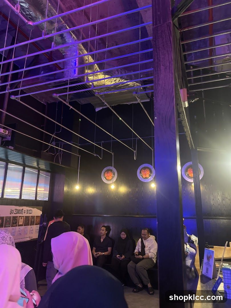 People waiting in a dimly lit room with unique decor