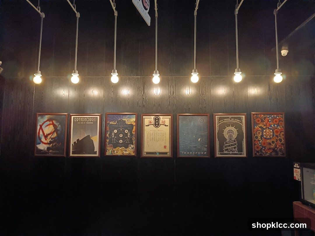 Framed posters on a dark wall