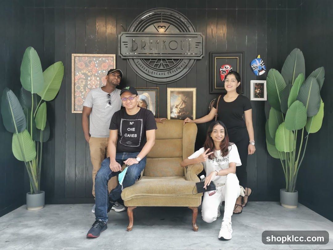 Group Posing in Front of Breakout Sign