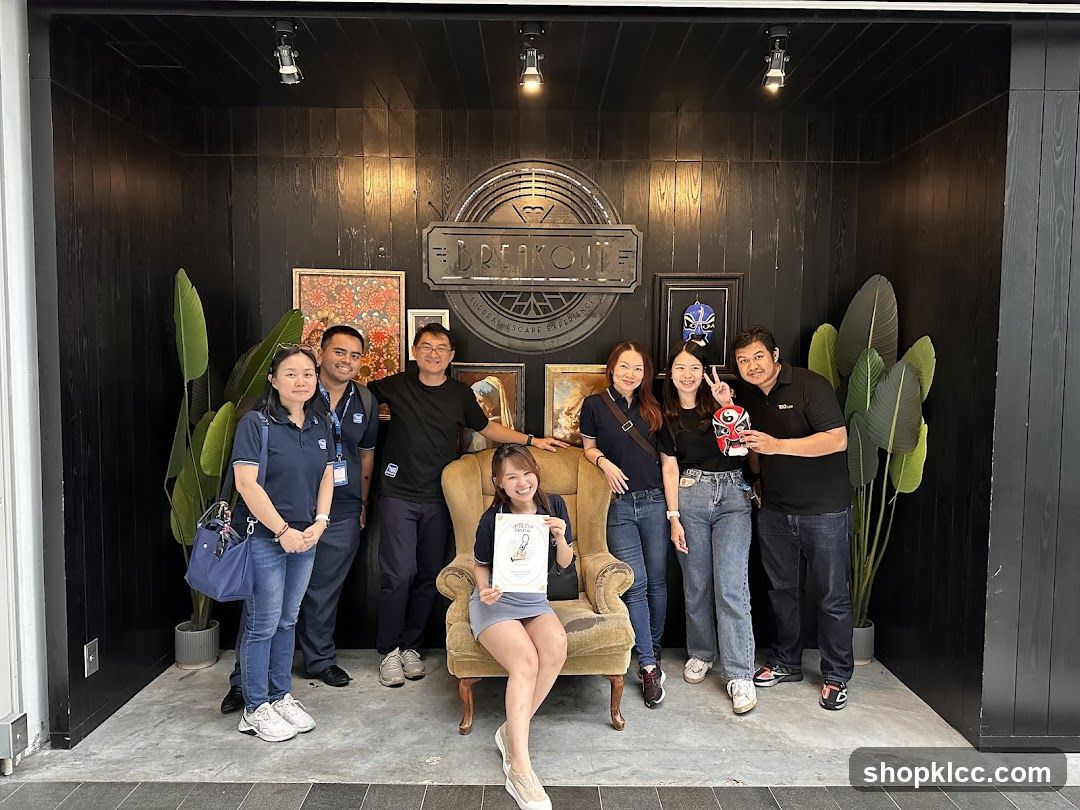 Group Posing in Front of Breakout Signage