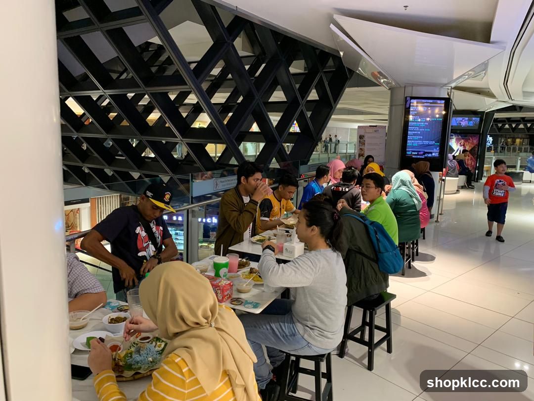 People eating at tables in a mall