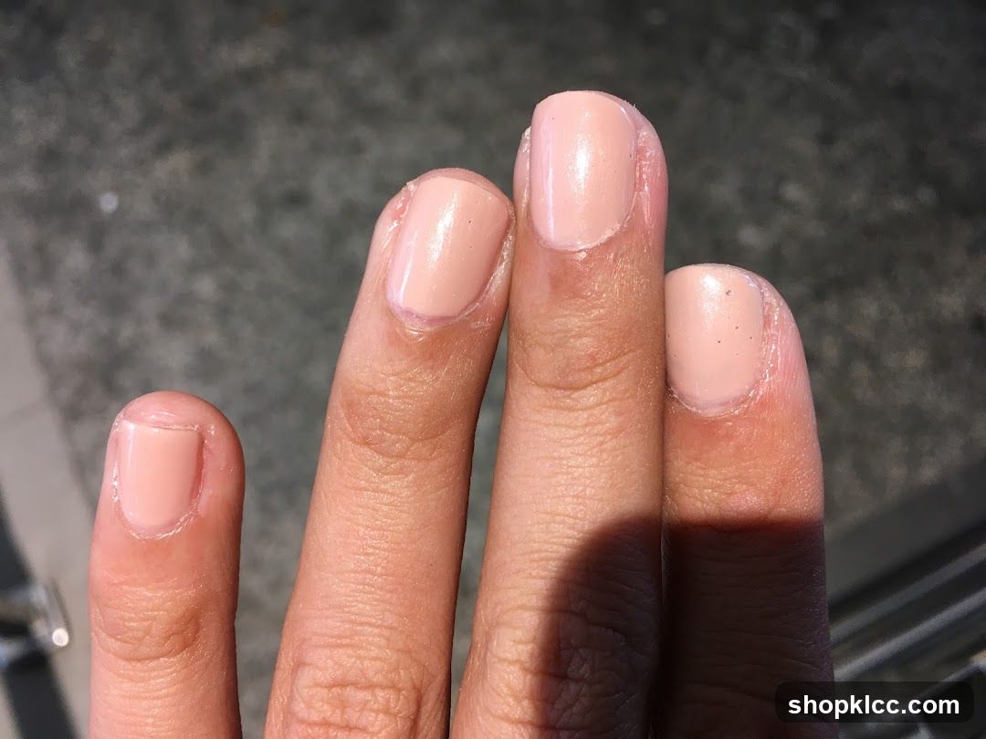 Fingers with Light Pink Nail Polish