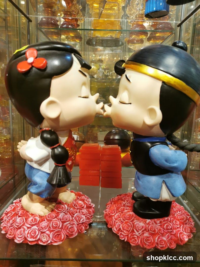 Cute Couple Statues in Display Case