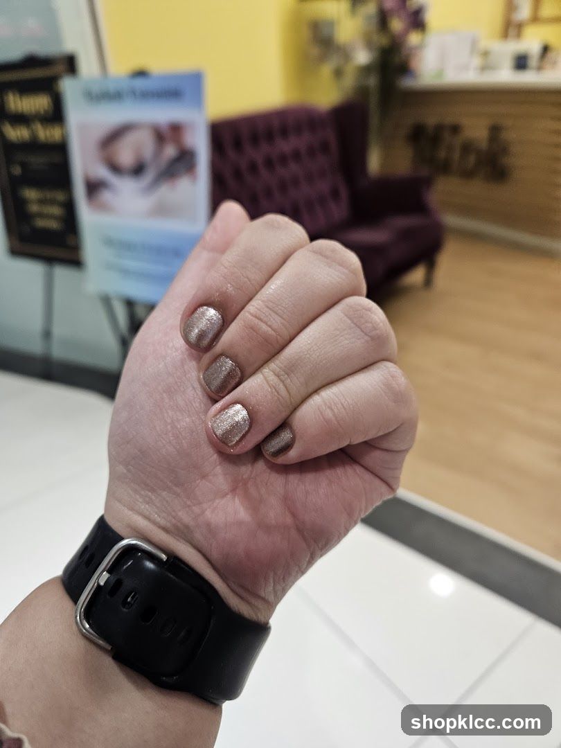 Manicured Hand with Glitter Polish