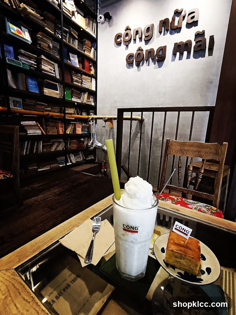 Coffee shop interior with books and a drink