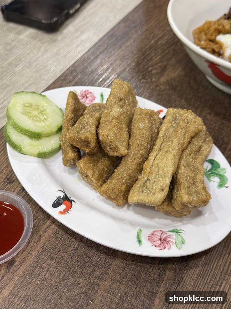 Fried Fish Cakes with Cucumber and Sauce