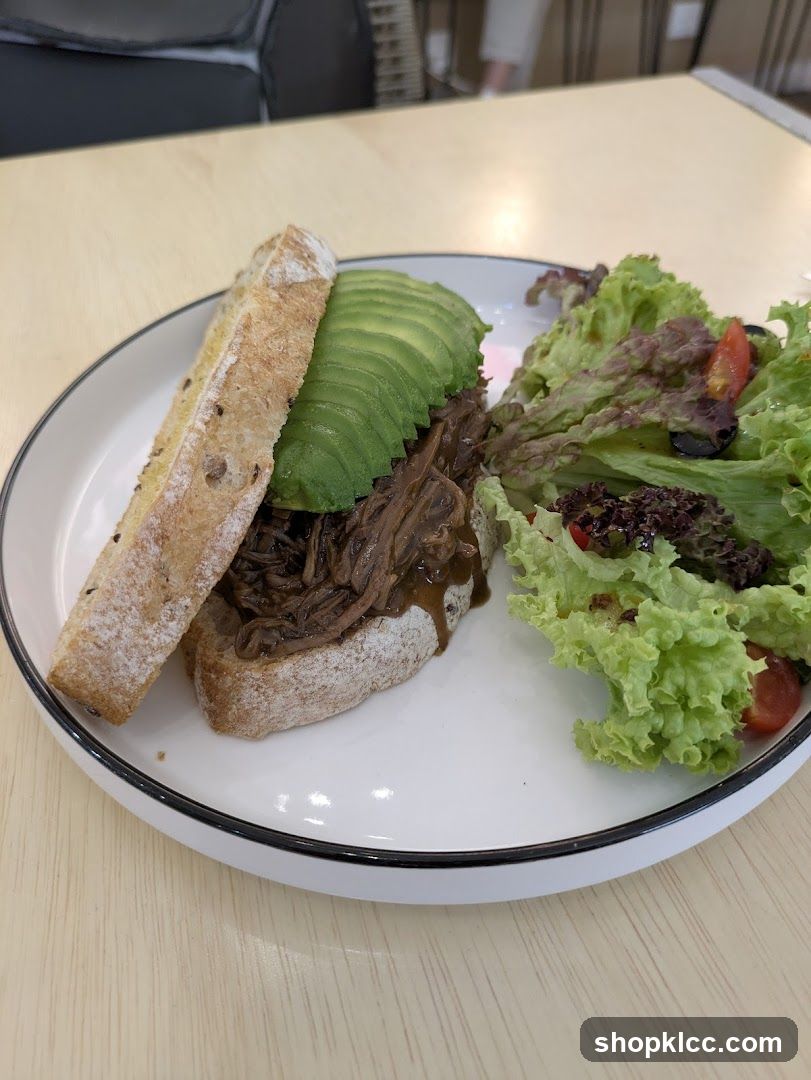 Pulled Meat Sandwich with Avocado and Salad