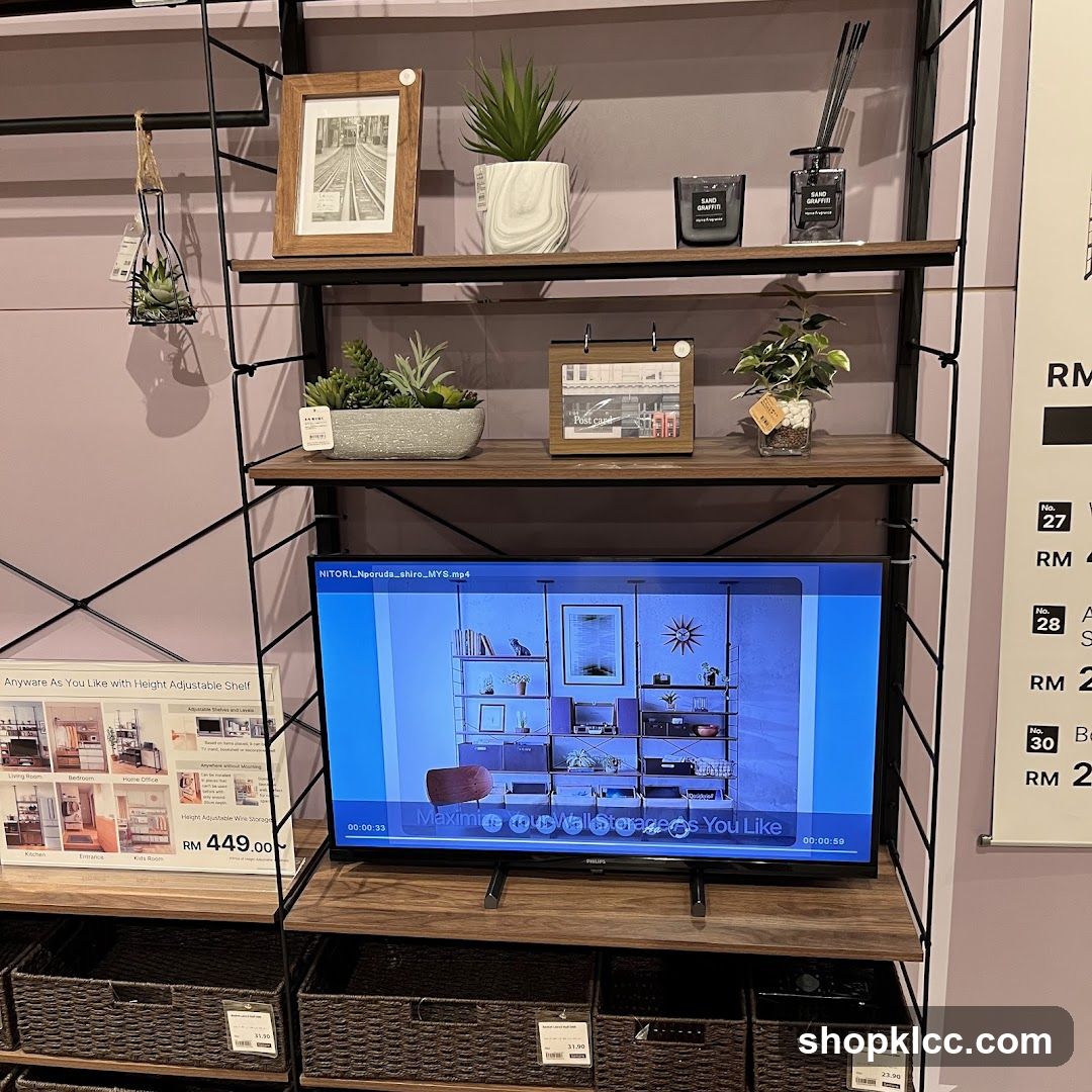Display Shelving Unit with Decorative Items and Television