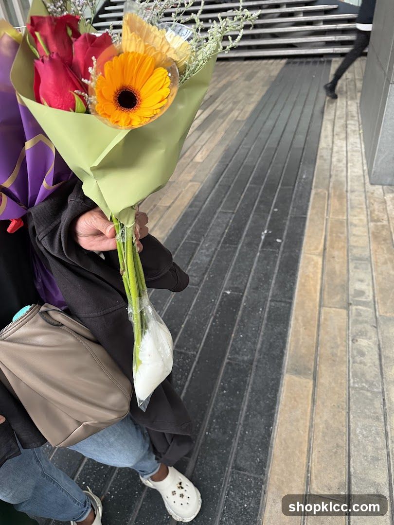 Person Holding Flowers