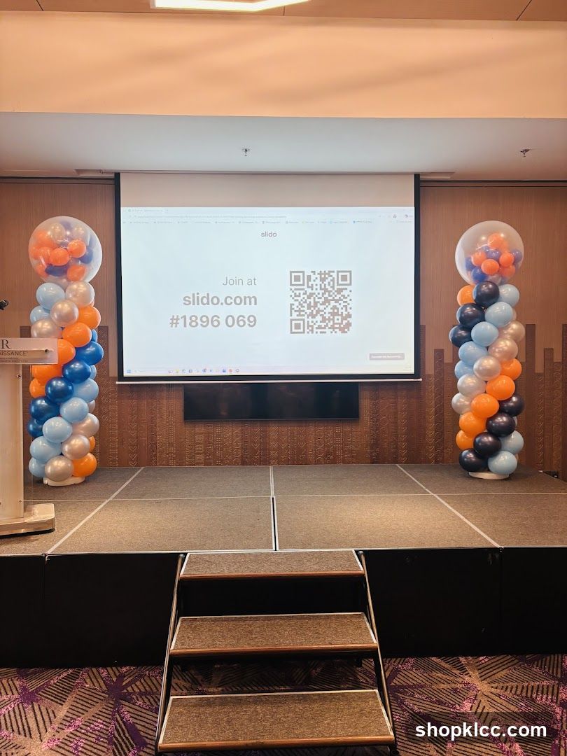 Stage with projector screen and balloons