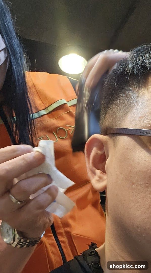 Hairdresser using clippers