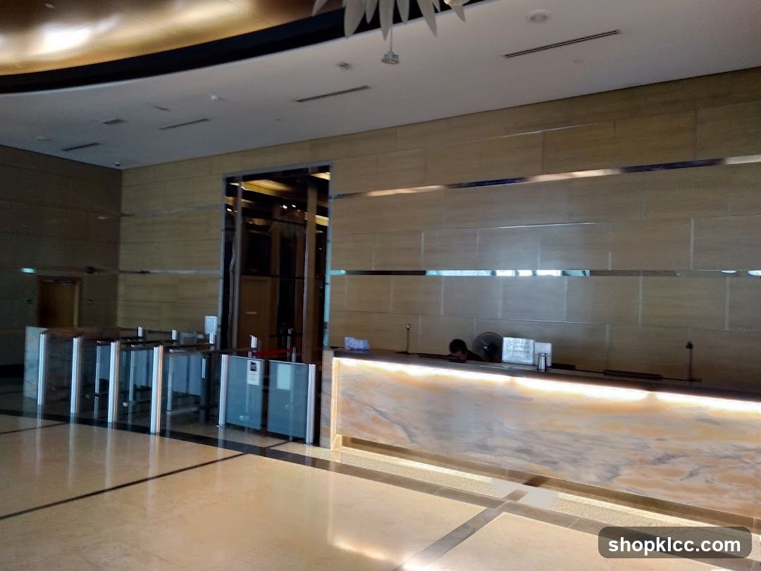 Lobby Entrance with Security Gates and Reception Desk