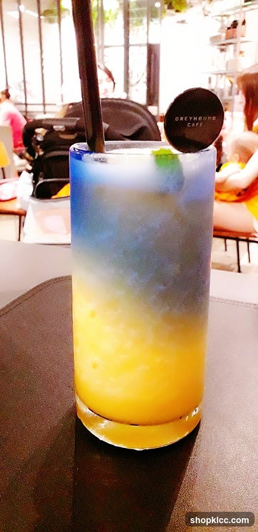 Layered Drink with Greyhound Cafe Logo