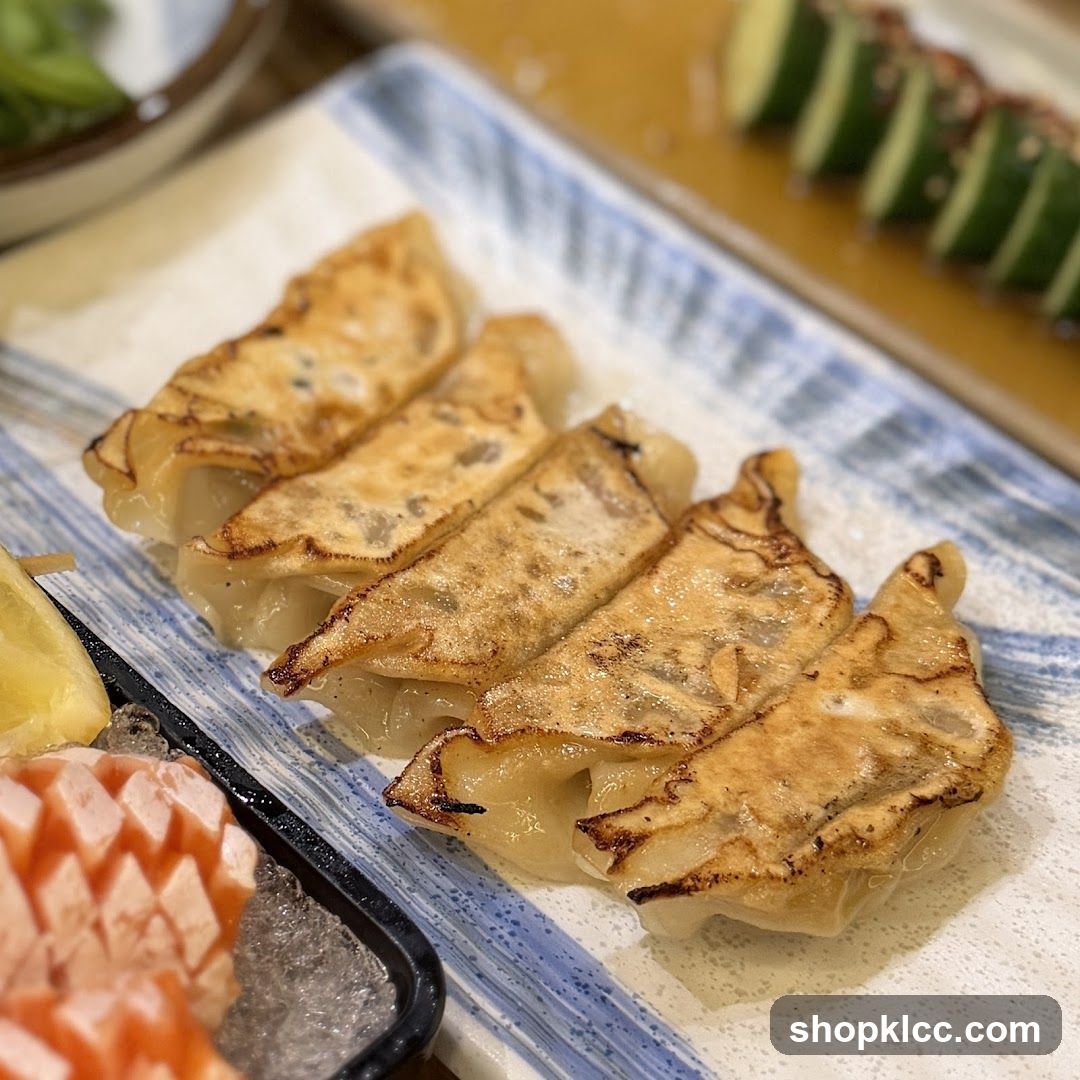 Gyoza on a plate with garnish