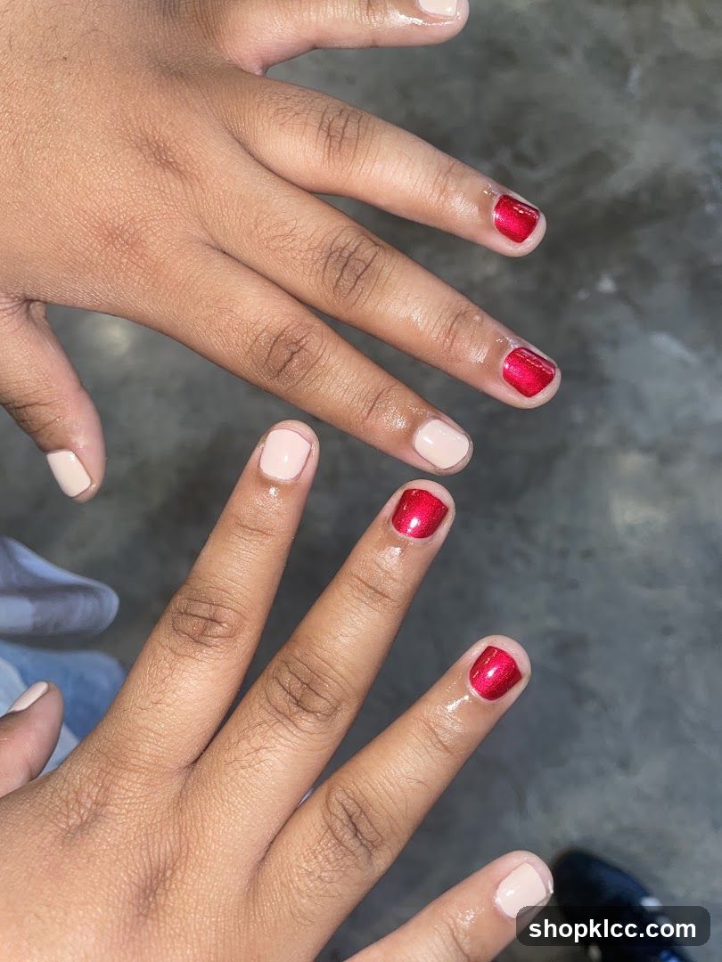 Two hands with manicured nails
