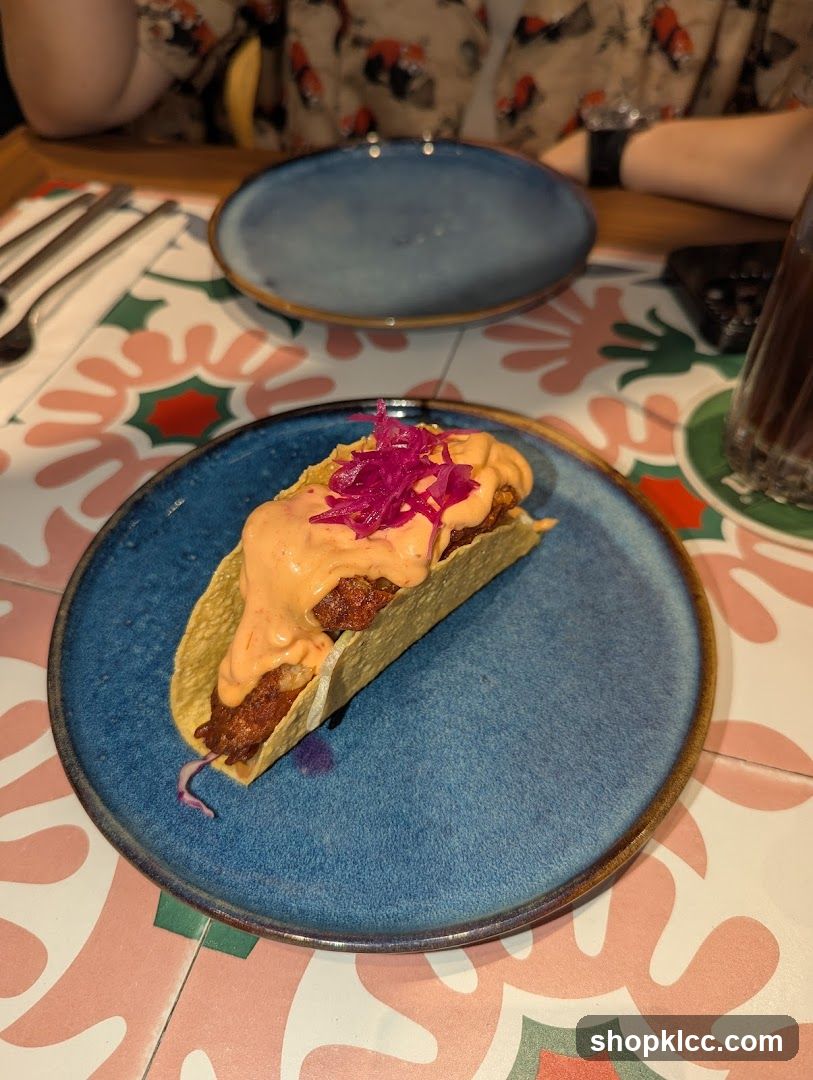 Taco with Sauce and Pickled Onions