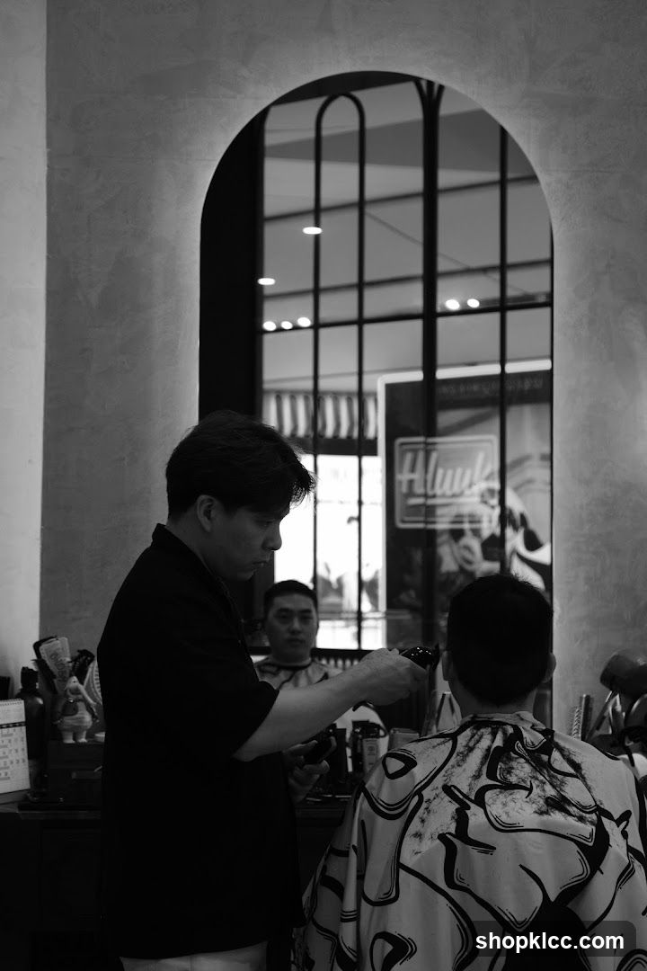 Barber cutting hair