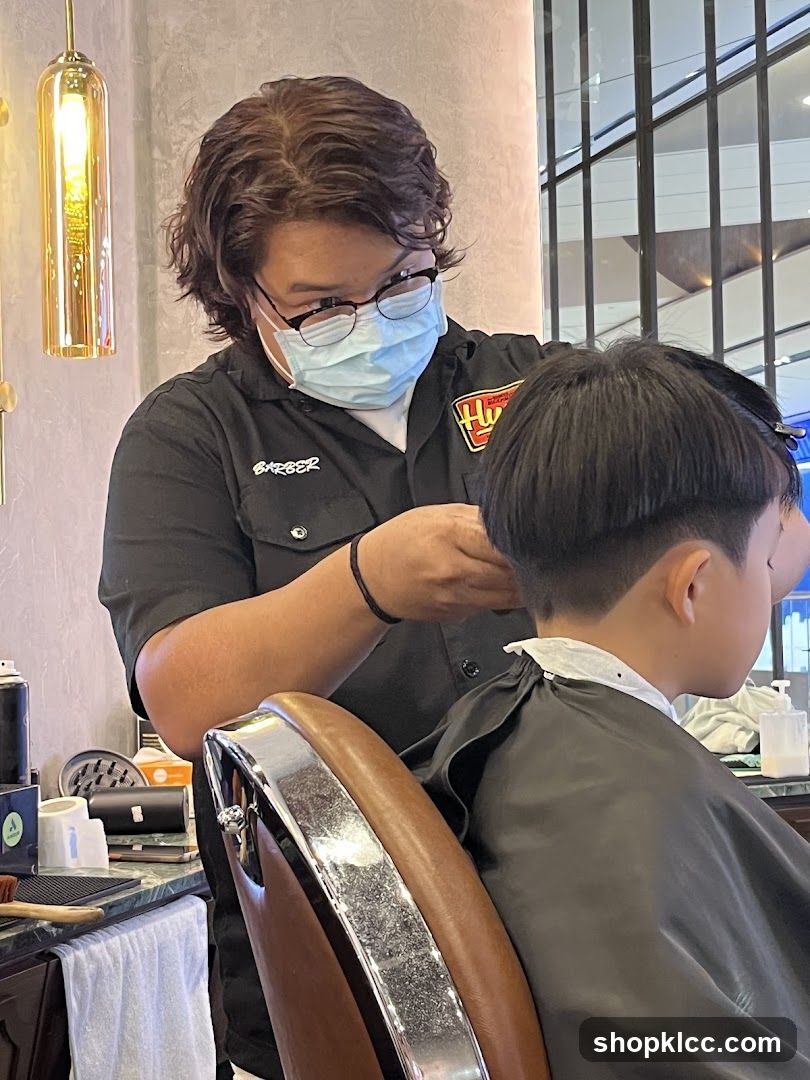 Barber cutting a child's hair