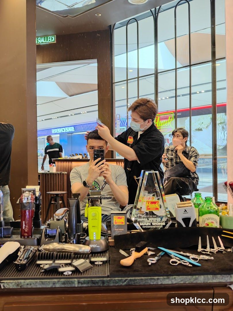 Barber cutting client's hair