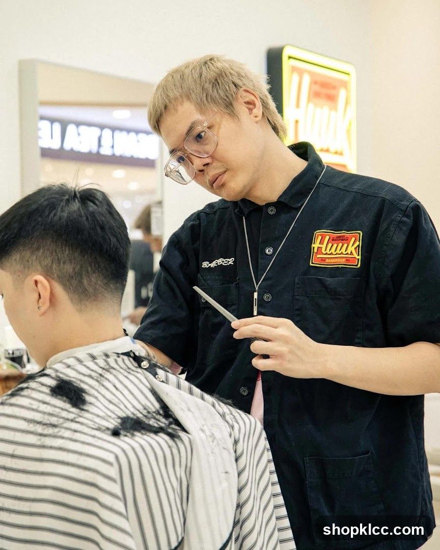 Barber cutting client's hair