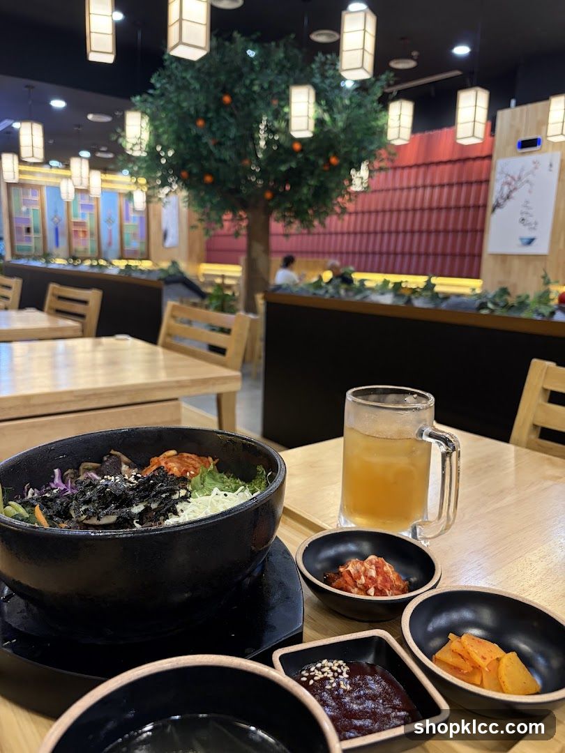 Korean Restaurant Interior with Banchan and Drink