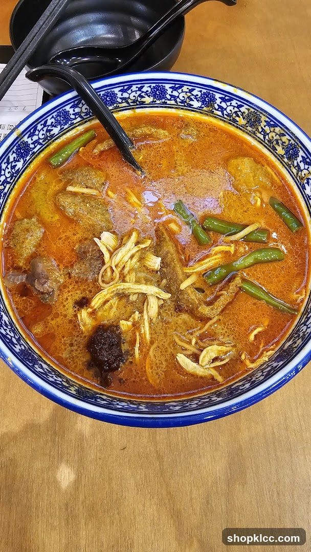 Bowl of Curry with Chicken and Vegetables