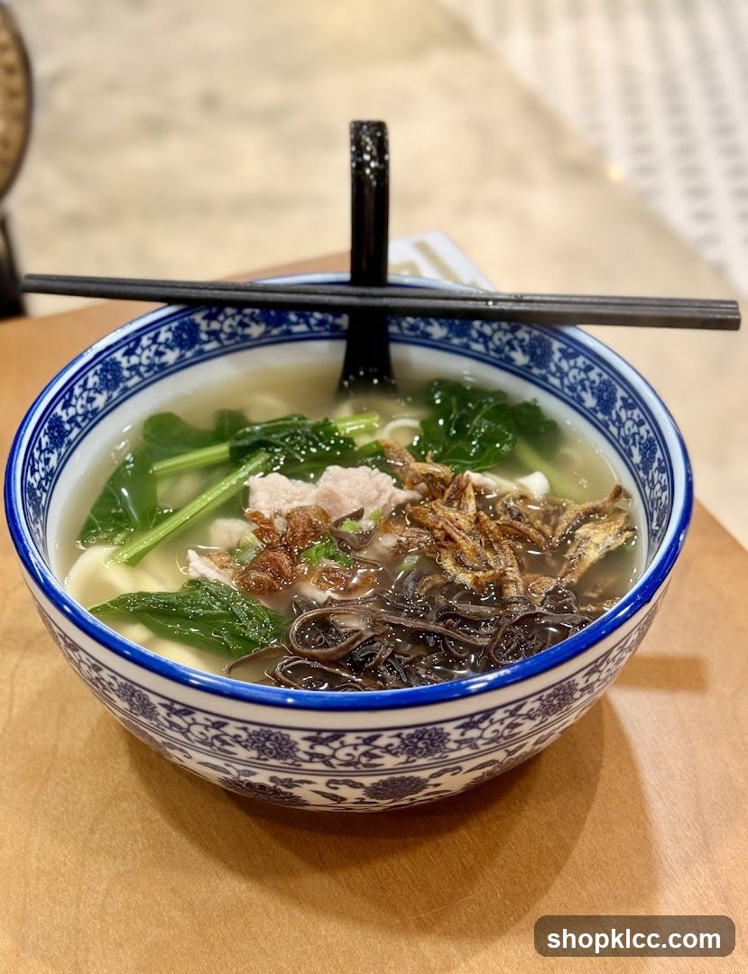 Bowl of Noodle Soup with Vegetables and Meat