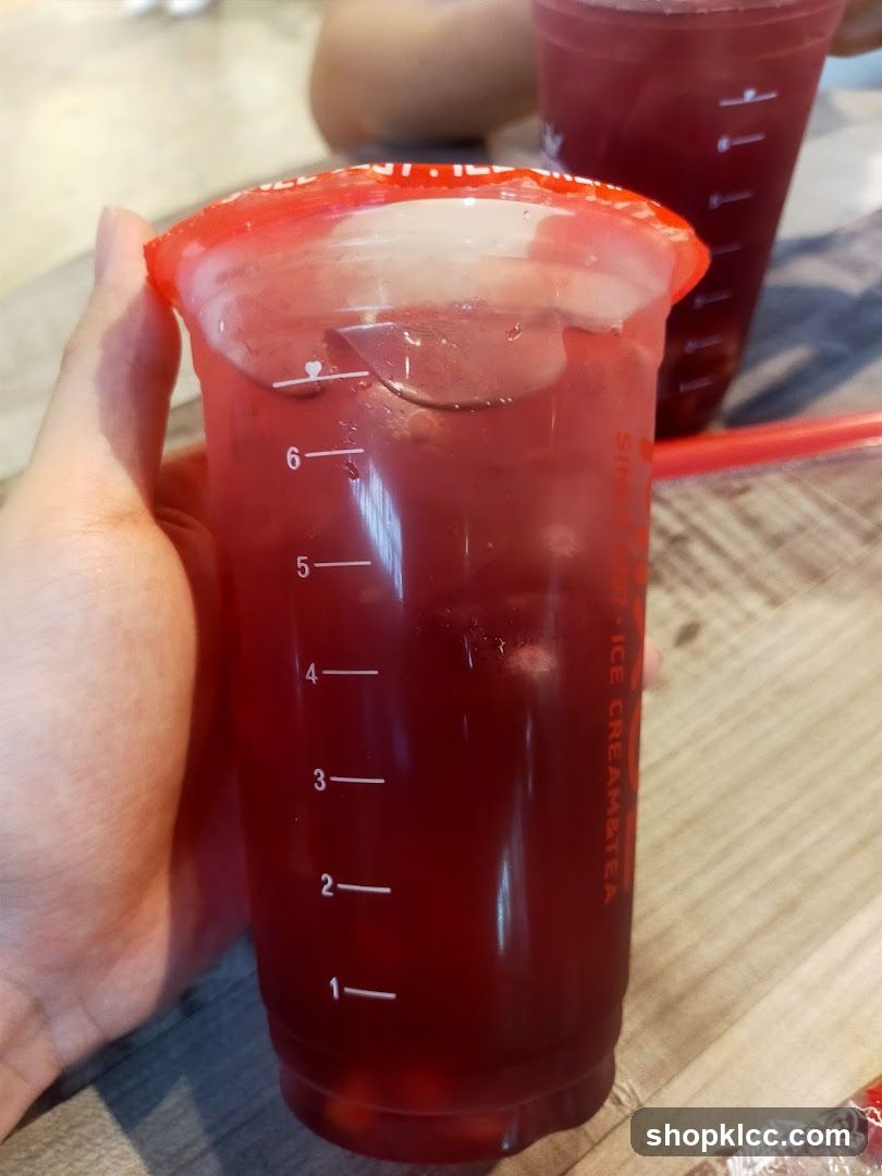 Red Drink in a Branded Cup