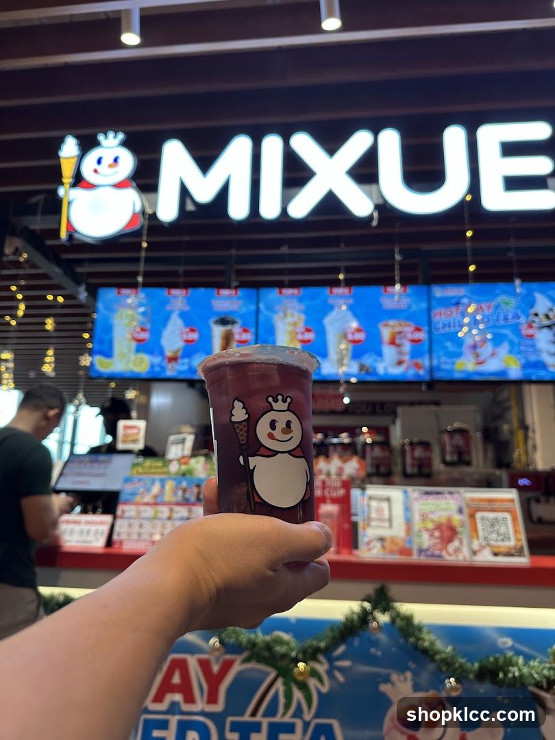 Mixue Drink with Storefront in Background