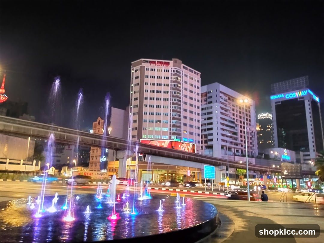 Cityscape with Fountain at Night