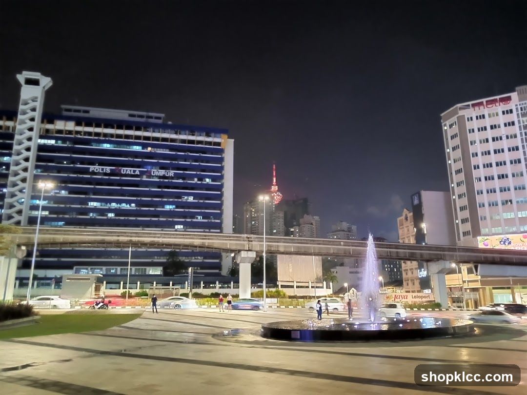 Cityscape at Night with Fountain