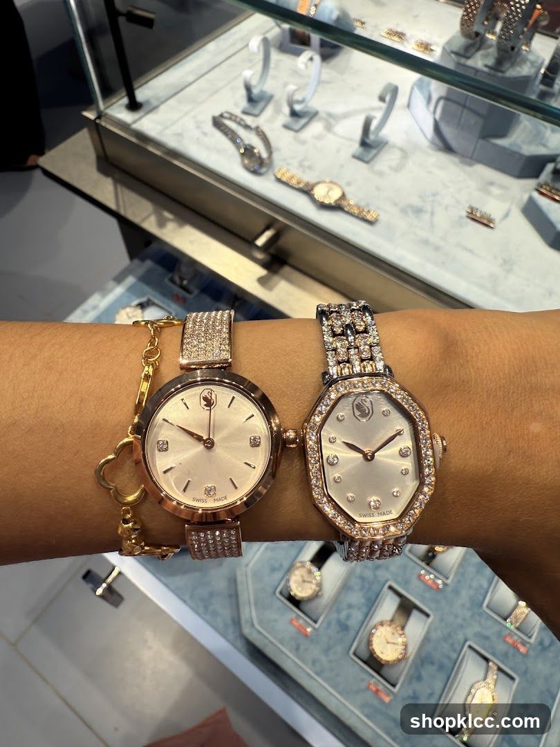 Two jeweled watches on a wrist