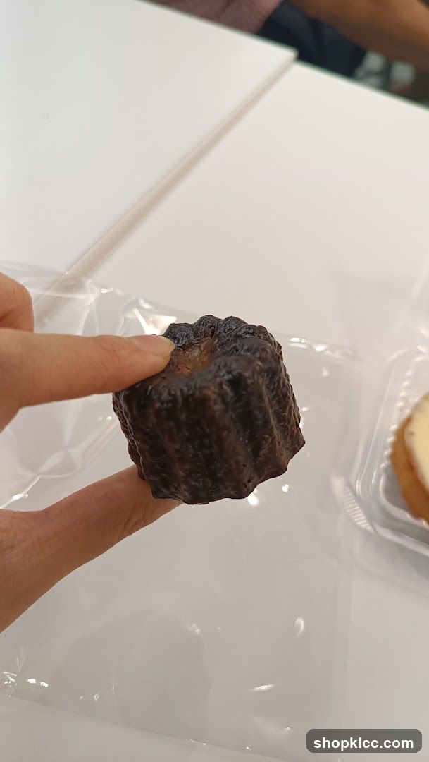 Close-up of a canelé pastry
