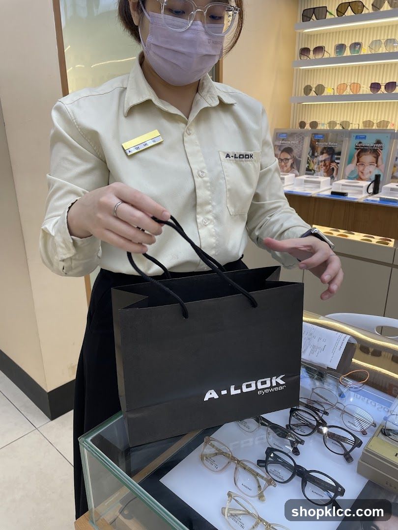 Optician holding a shopping bag