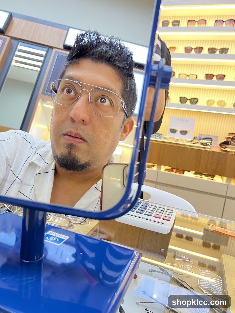 Man trying on glasses