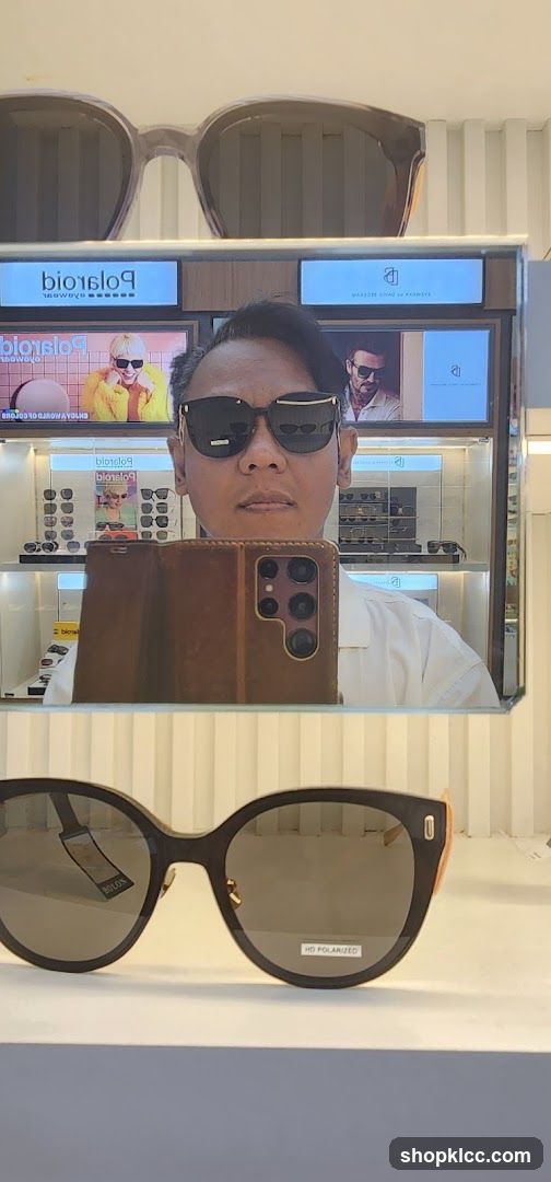Man trying on sunglasses