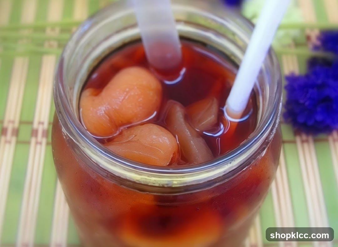 Jars of preserved fruit in syrup