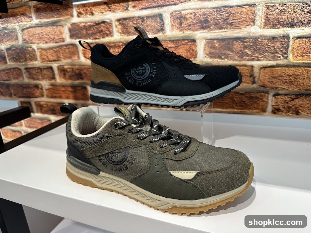 Two pairs of sneakers on display