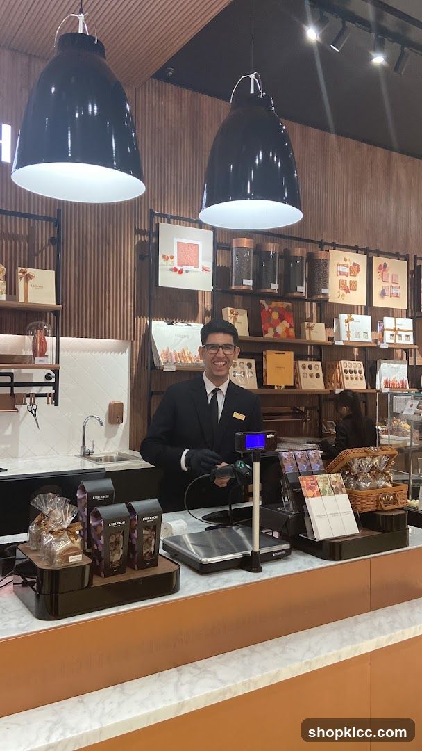 Smiling employee behind a counter